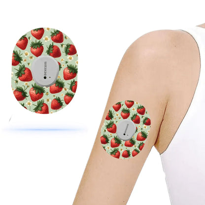 Dexcom G7 Strawberry CGM-sensor överpatch med jordgubbsmotiv på arm